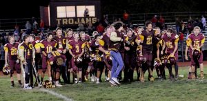 The Girard Trojan football team celebrates after being crowned regional champions after their upset win over the Columbus Titans on Friday. JOYCE KOVACIC